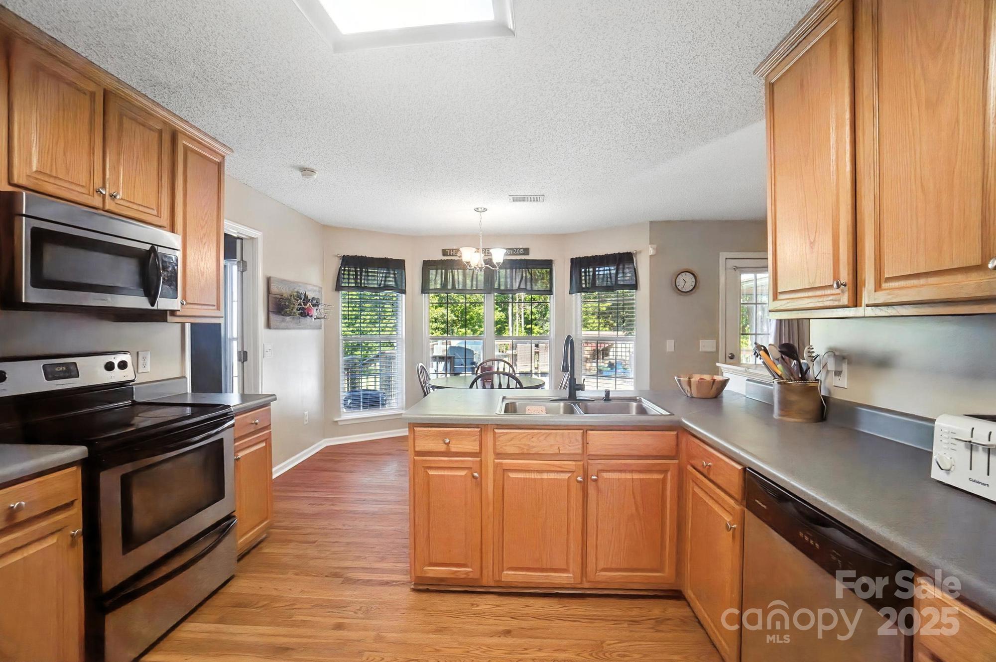 1116 State Rd S-29-770 Kershaw, SC 29067 - Photo 7 of 48 a kitchen with a sink stove and microwave