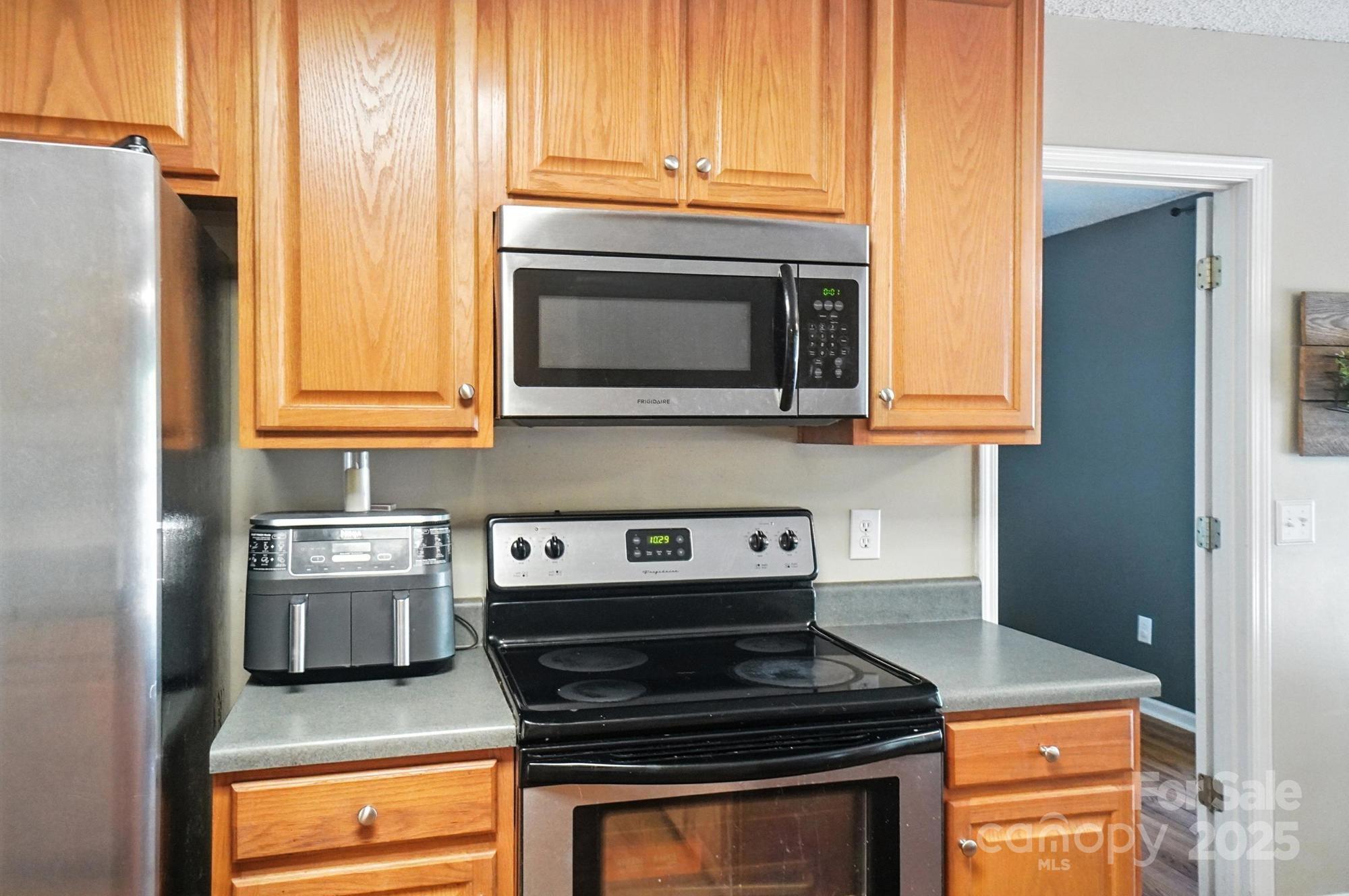 1116 State Rd S-29-770 Kershaw, SC 29067 - Photo 10 of 48 a kitchen with stainless steel appliances granite countertop a stove and a microwave