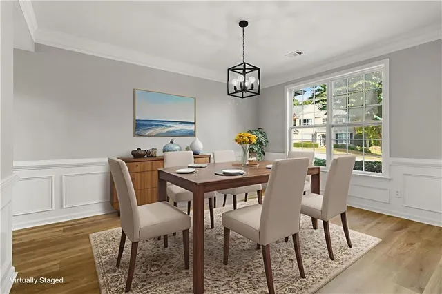 a view of a room with wooden floor staircase and windows