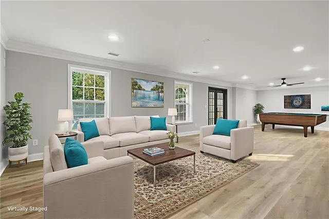 a kitchen with granite countertop a refrigerator sink and cabinets
