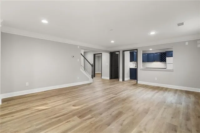 an empty room with closet and a ceiling fan