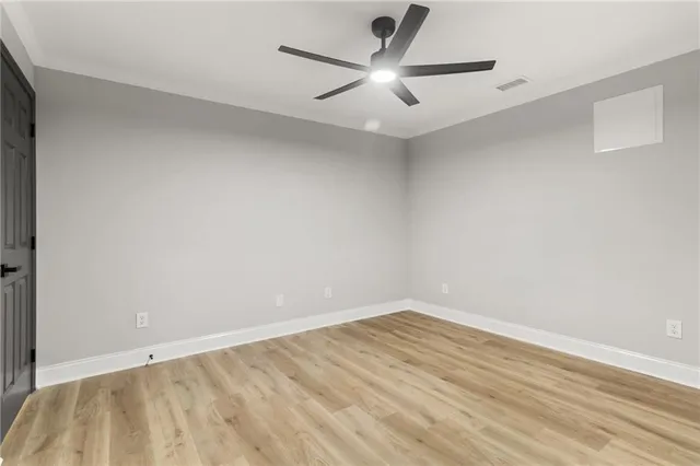 a view of balcony with wooden floor