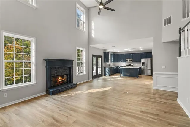 a living room with a fireplace and a window