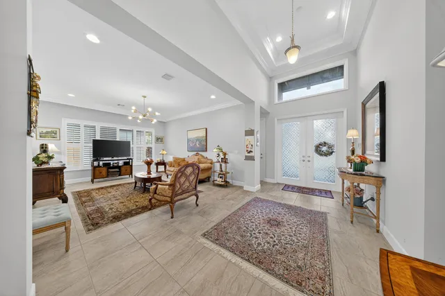 an aerial view of a house with a garden and swimming pool