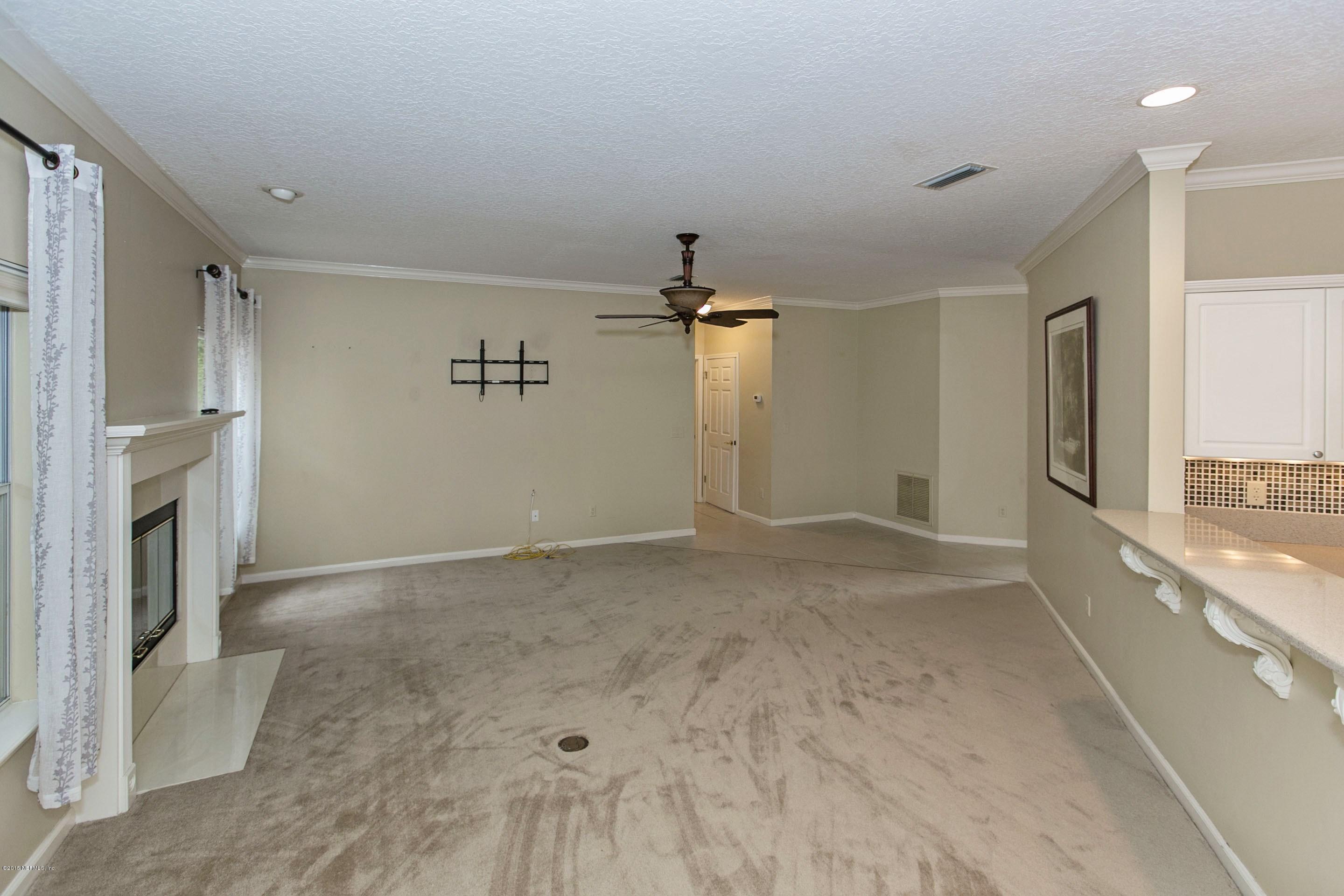 441 Big Tree Road Ponte Vedra Beach, FL 32082 - Photo 8 of 22 a view of a livingroom with a fireplace