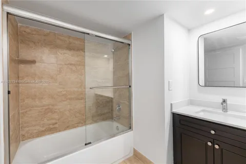 a bathroom with a bathtub and a sink