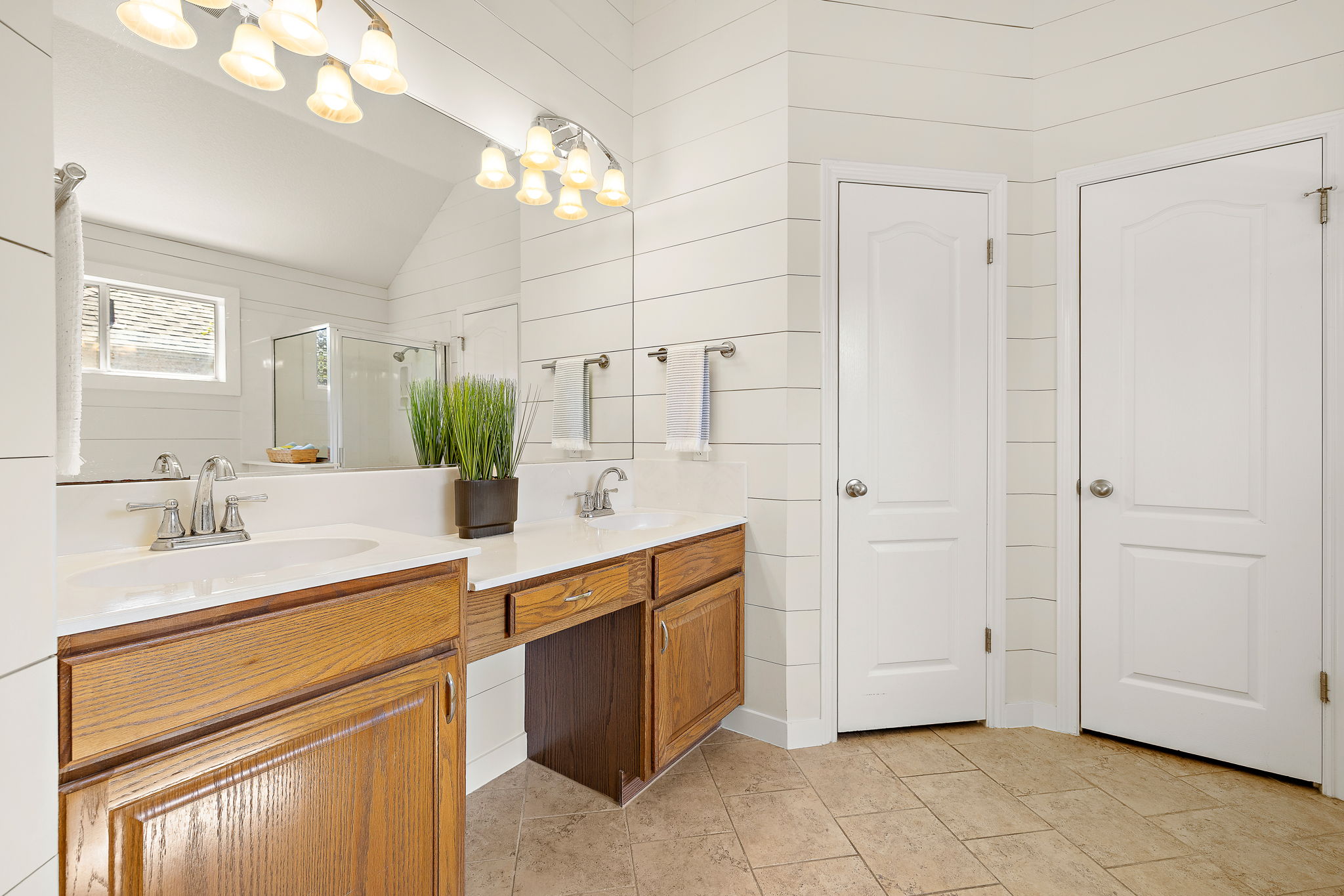 1102 Nelson Ranch Road Cedar Park, TX 78613 - Photo 24 of 37 A naturally illuminated primary bathroom features a double vanity and sleek tile flooring.