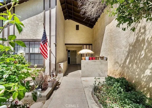a front view of a house with outdoor space