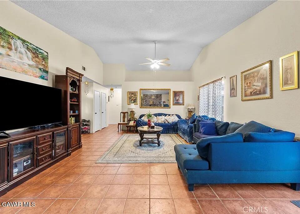 45109 18th Street West Lancaster, CA 93534 - Photo 3 of 9 a living room with furniture and a flat screen tv