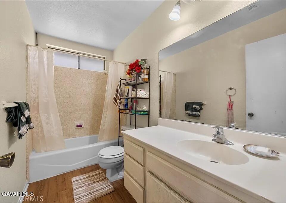 45109 18th Street West Lancaster, CA 93534 - Photo 6 of 9 a bathroom with a sink a toilet and shower