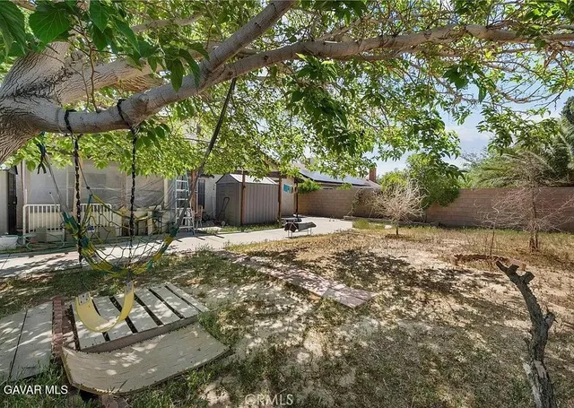 a view of a backyard with sitting area