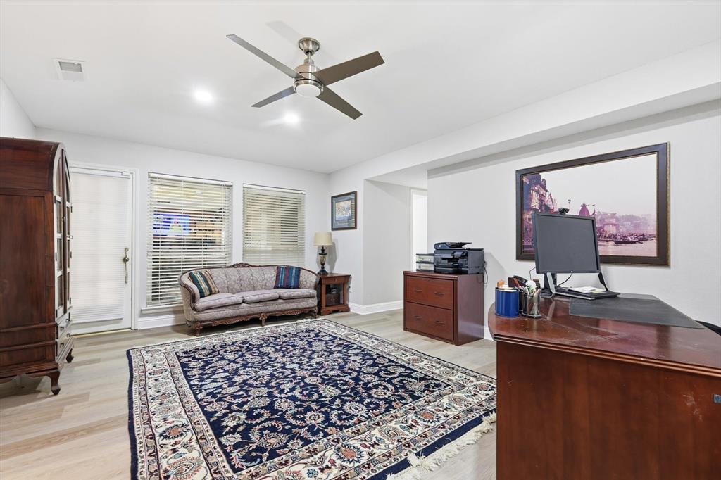 4208 Bretton Bay Circle Dallas, TX 75287 - Photo 13 of 32 a living room with furniture and a flat screen tv