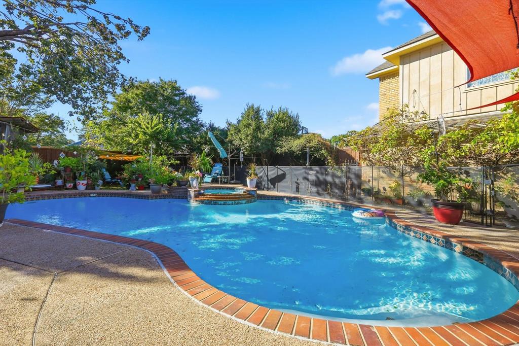 4208 Bretton Bay Circle Dallas, TX 75287 - Photo 24 of 32 a view of a swimming pool with an outdoor seating