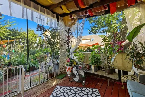 a view of a chairs in patio of a house