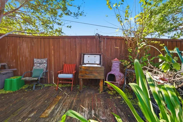 an aerial view of residential houses with outdoor space and swimming pool