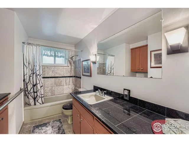 a workspace with furniture hardwood and a window