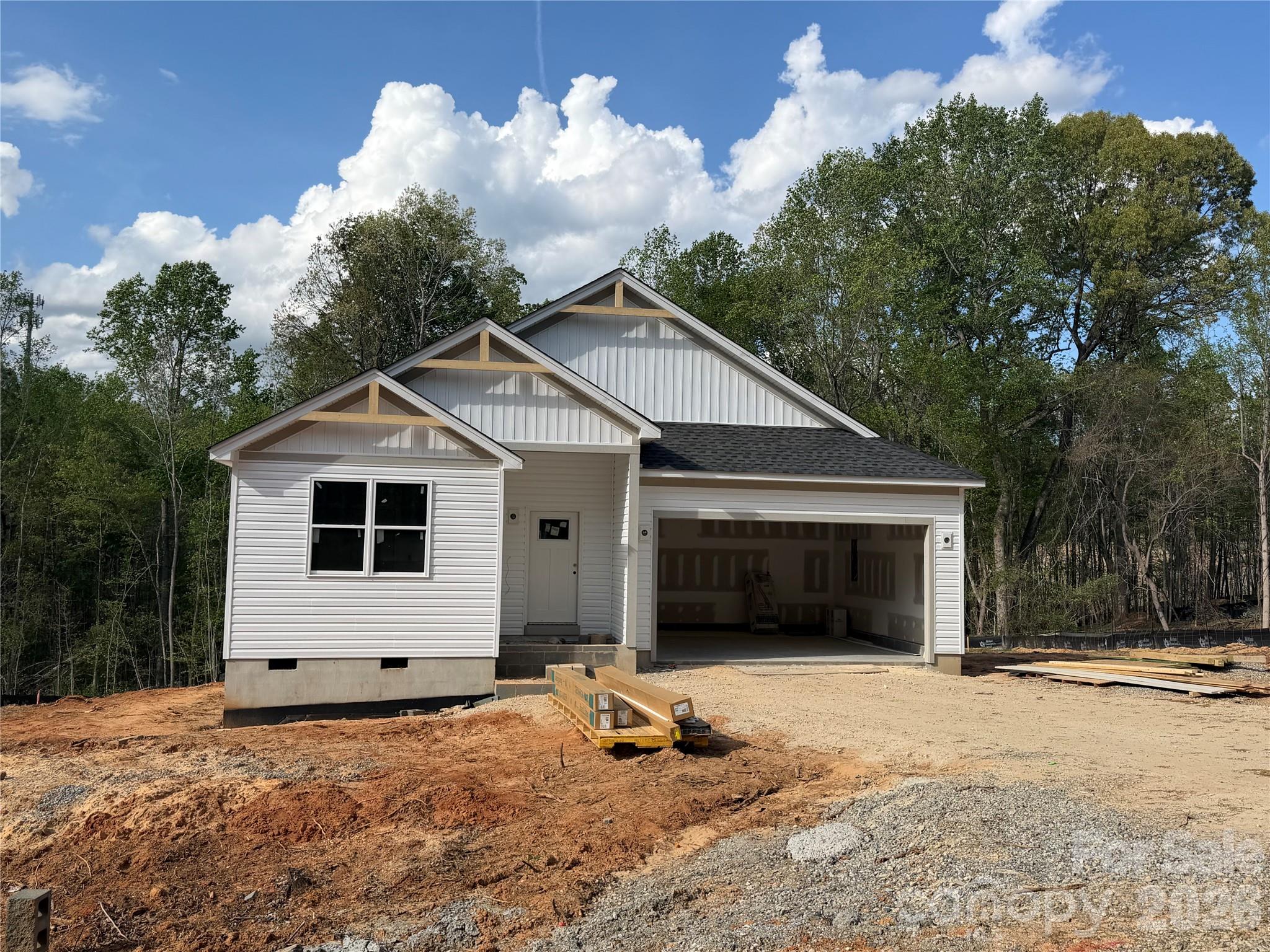 2705 Andrew Point Drive Denver, NC 28037 - Photo 2 of 6 a front view of a house with a yard