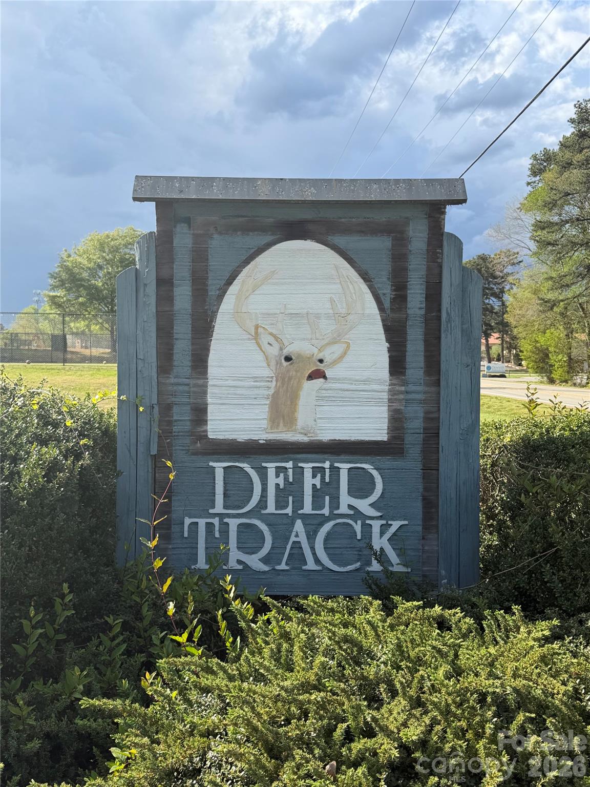 2705 Andrew Point Drive Denver, NC 28037 - Photo 3 of 6 a front view of a house with a garden