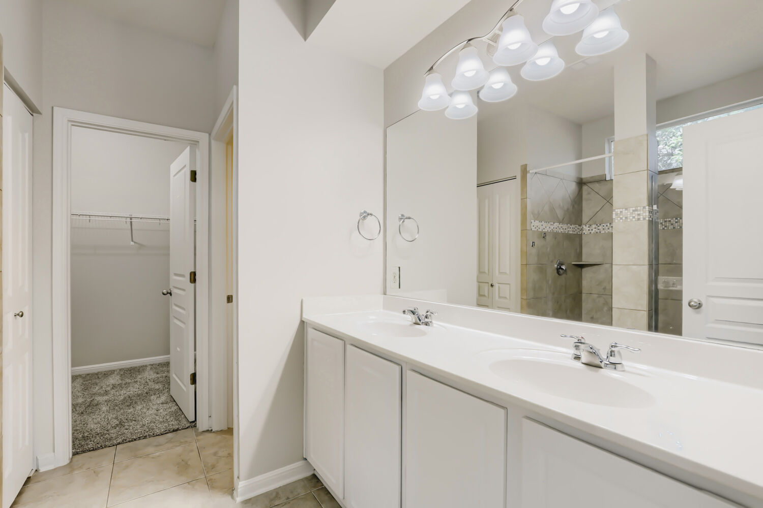 5136 Hellman Kyle, TX 78640 - Photo 16 of 25 a bathroom with a double vanity sink mirror and shower