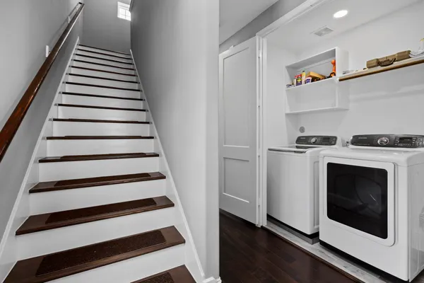 a view of a hallway with washer and dryer
