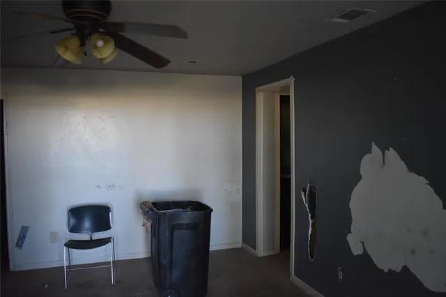 a view of a livingroom with furniture and closet