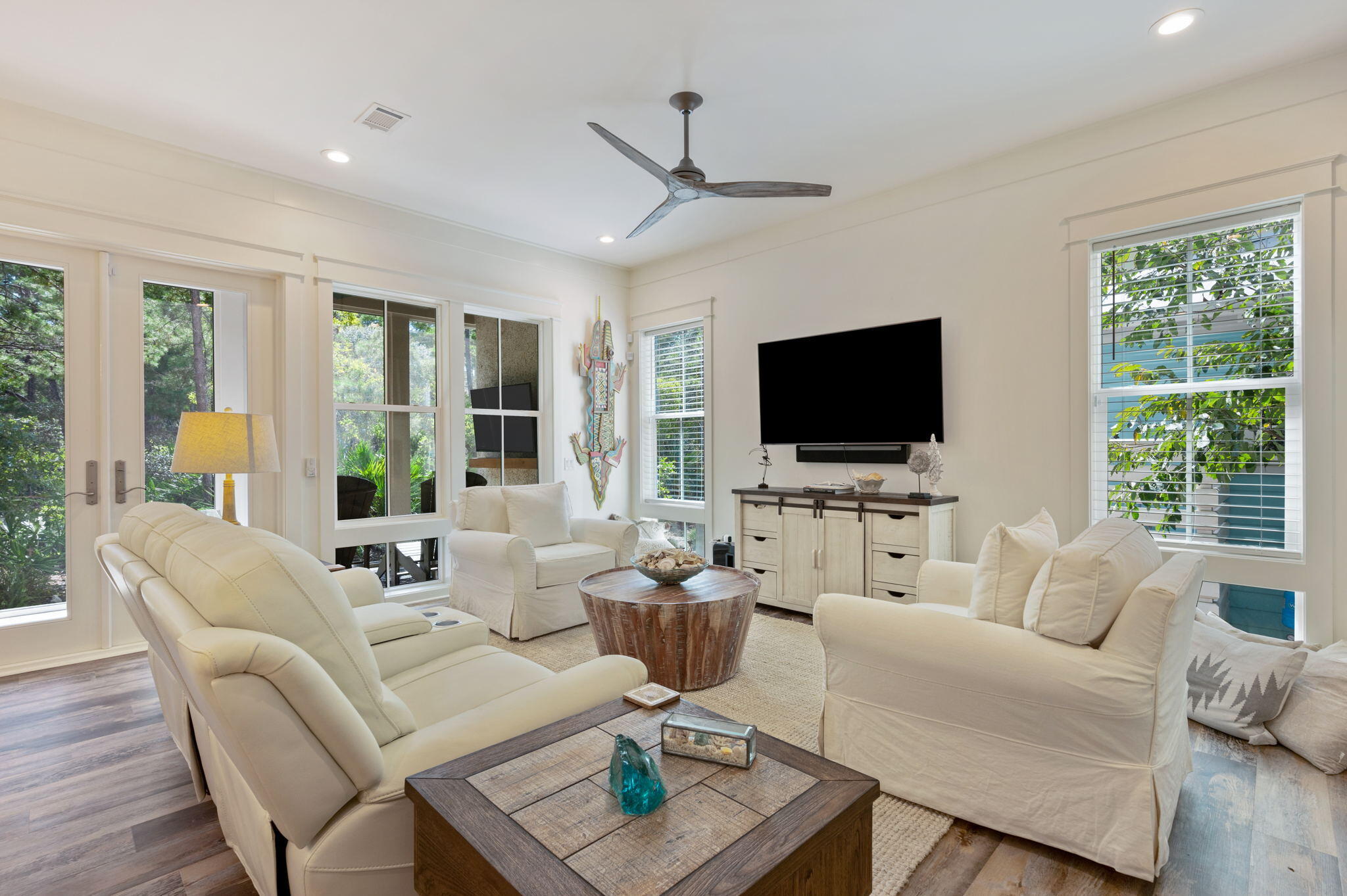 295 Matt's Way Santa Rosa Beach, FL 32459 - Photo 13 of 48 a living room with furniture a flat screen tv and a large window