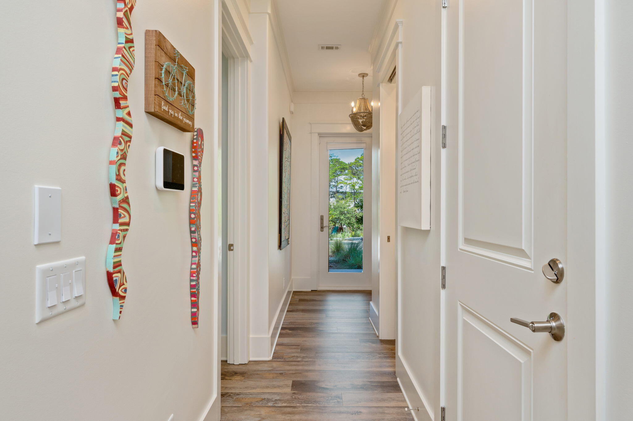 295 Matt's Way Santa Rosa Beach, FL 32459 - Photo 22 of 48 a view of a hallway with wooden floor and closet