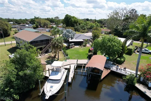 an aerial view of a house with outdoor space patio and outdoor seating