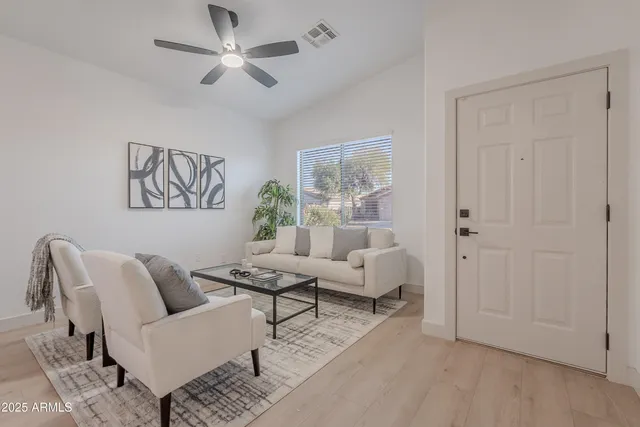 a living room with furniture and a window