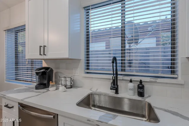 a kitchen with a sink and cabinets
