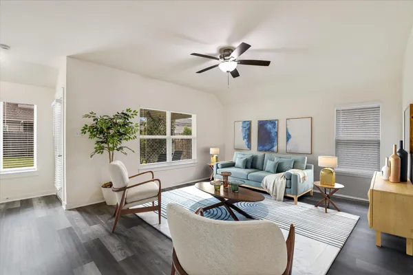 a living room with furniture and a window