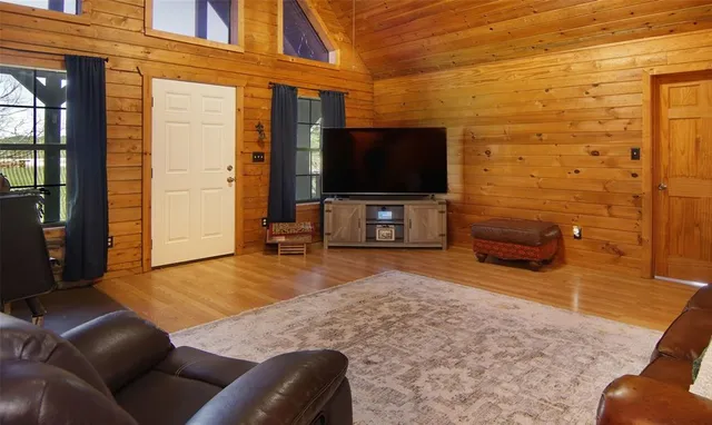 a living room with furniture and a flat screen tv