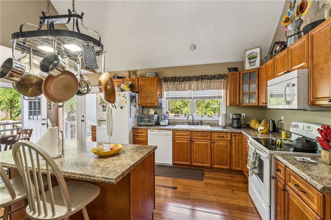 189 Little Choestoea Road Westminster, SC 29693 - Photo 10 of 38 This spacious kitchen offers ample countertop space and natural light, perfect for everyday living.