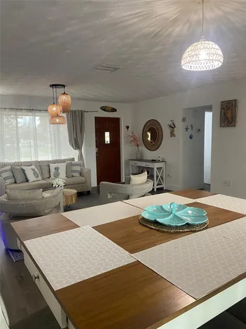 a living room with furniture and a table