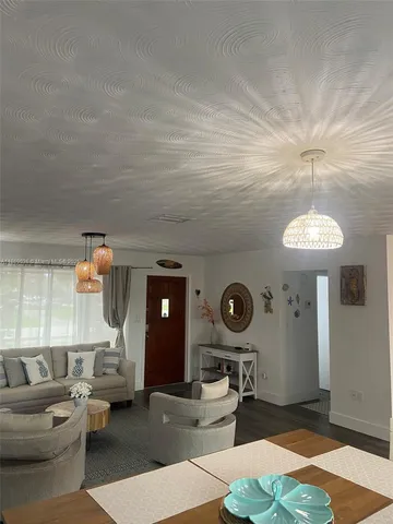 a living room with furniture and a table