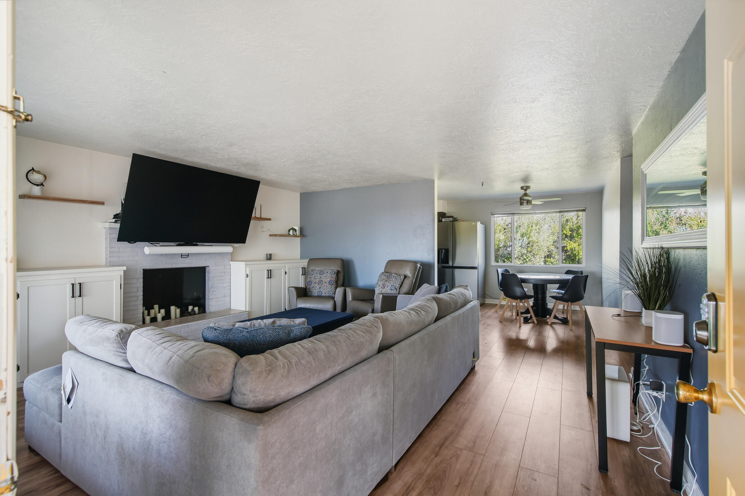 664 Southwest 35th Street Redmond, OR 97756 - Photo 5 of 19 a living room with furniture a fireplace and a flat screen tv