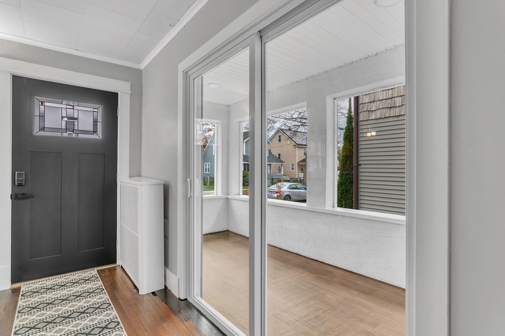 34 Brunswick Street Springfield, MA 01108 - Photo 27 of 31 a view of a hallway with bathroom and wooden floor