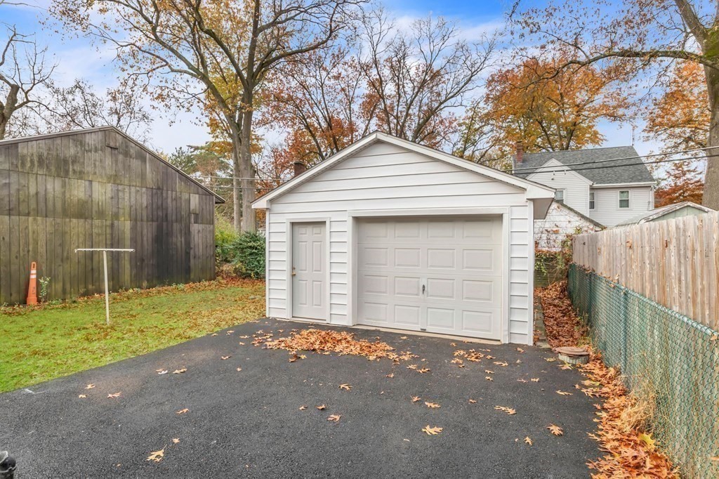 34 Brunswick Street Springfield, MA 01108 - Photo 29 of 31 a front view of a house with a yard and garage