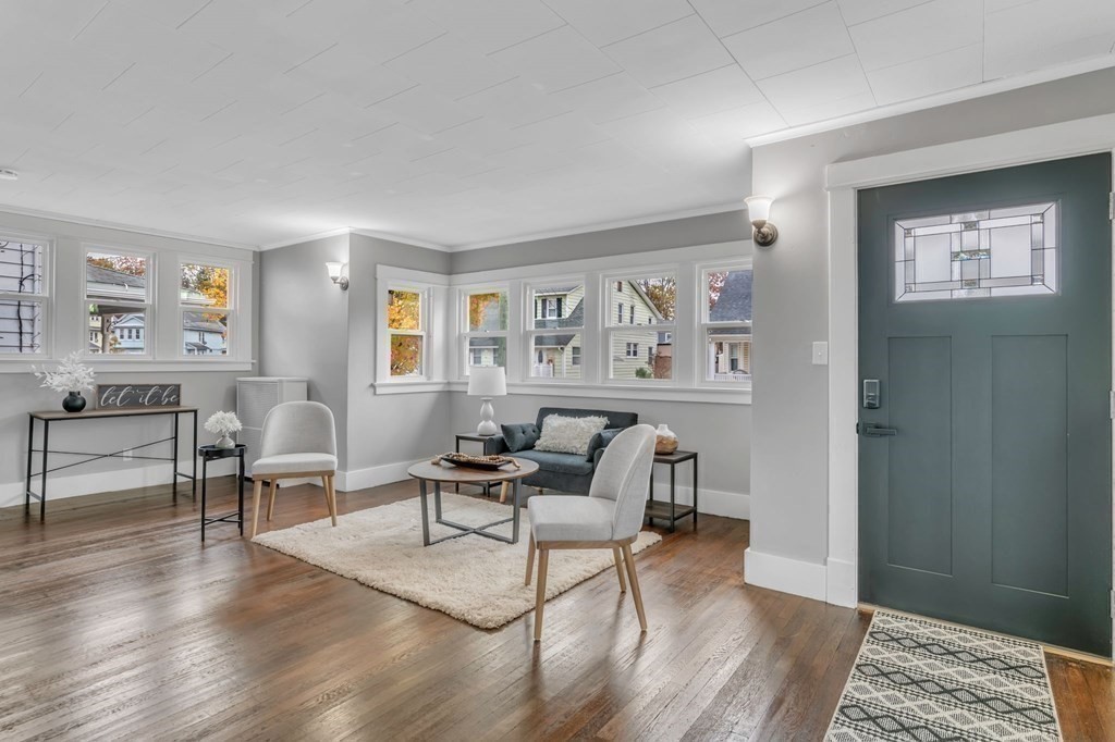 34 Brunswick Street Springfield, MA 01108 - Photo 4 of 31 a living room with furniture and a wooden floor