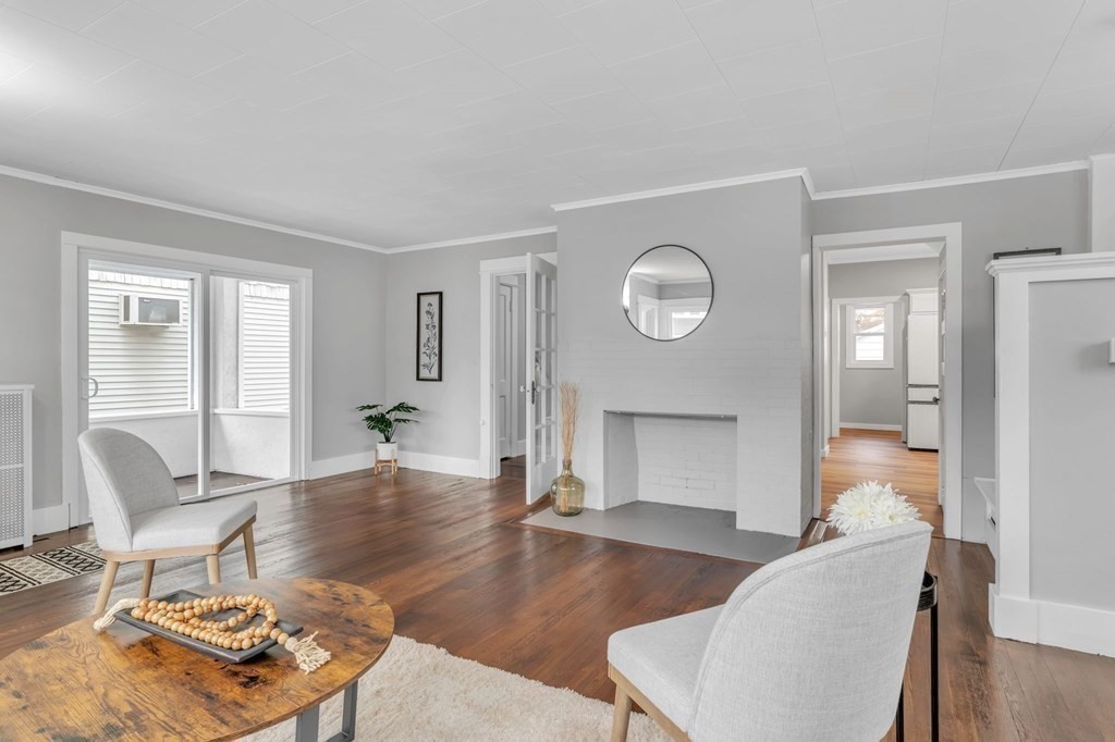 34 Brunswick Street Springfield, MA 01108 - Photo 6 of 31 a living room with furniture and a wooden floor
