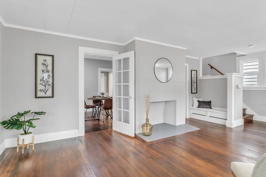 34 Brunswick Street Springfield, MA 01108 - Photo 7 of 31 a view of a room with wooden floor and a potted plant