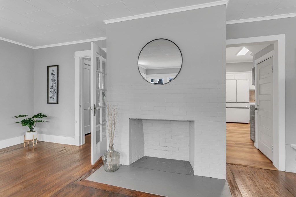 34 Brunswick Street Springfield, MA 01108 - Photo 8 of 31 a view of a room with wooden floor and potted plant