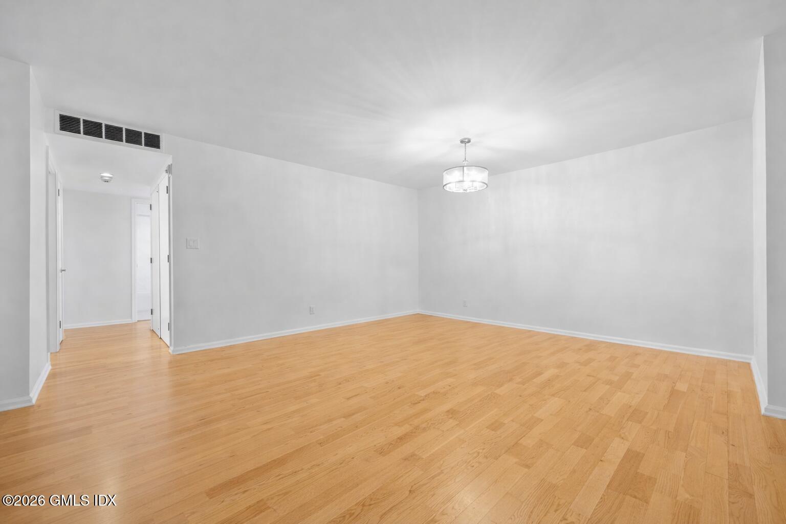 140 Field Point Road, Unit 2 Greenwich, CT 06830 - Photo 13 of 36 a view of an empty room with a chandelier fan