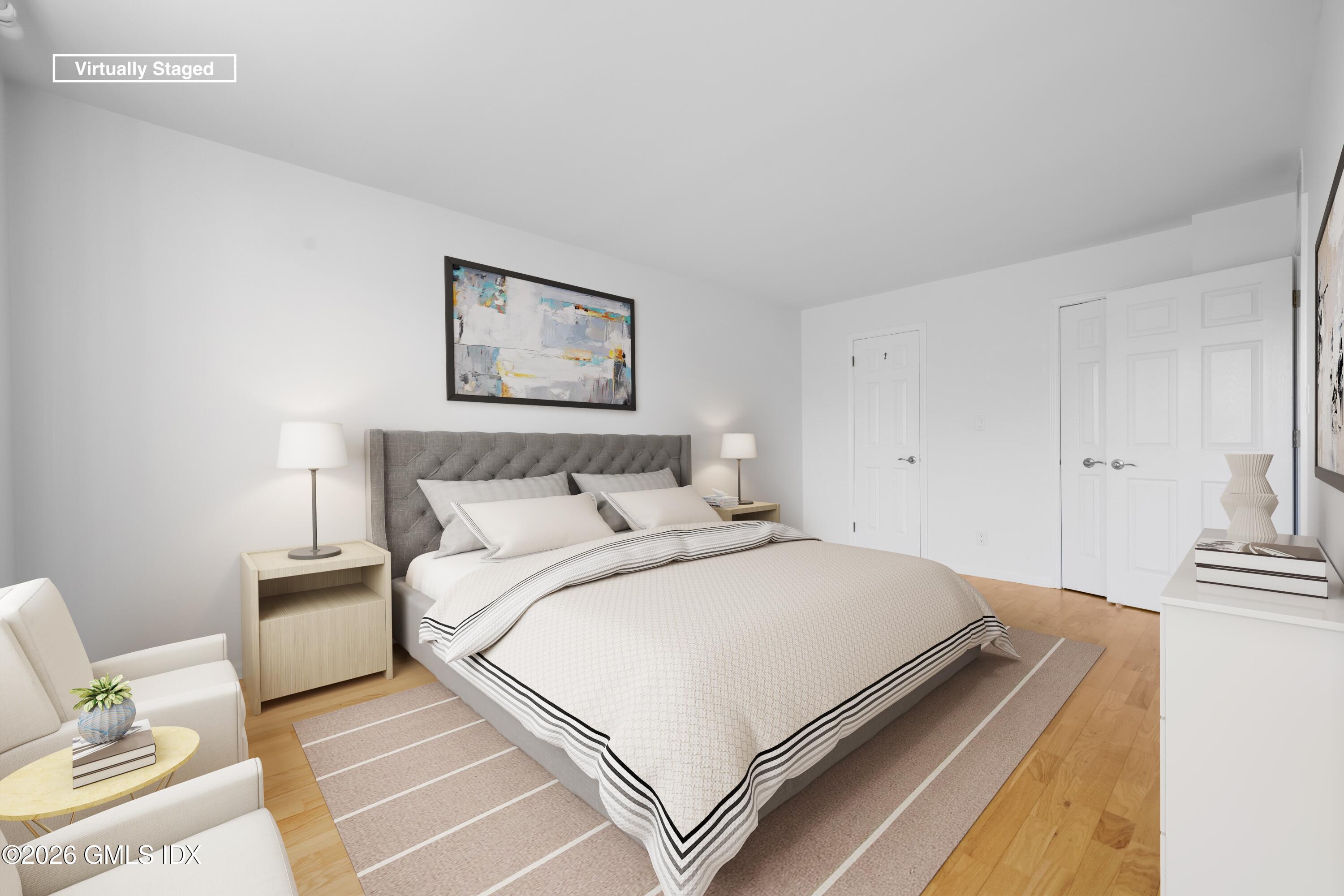 140 Field Point Road, Unit 2 Greenwich, CT 06830 - Photo 17 of 36 a bedroom with a bed and a couch