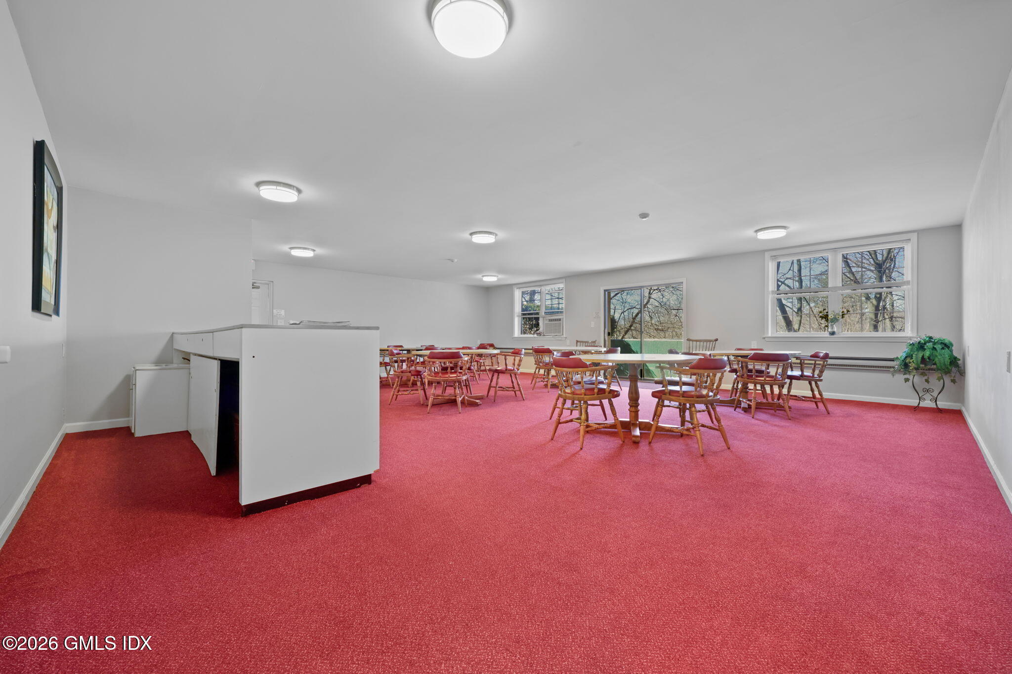 140 Field Point Road, Unit 2 Greenwich, CT 06830 - Photo 33 of 36 a view of a room with gym equipment and a table