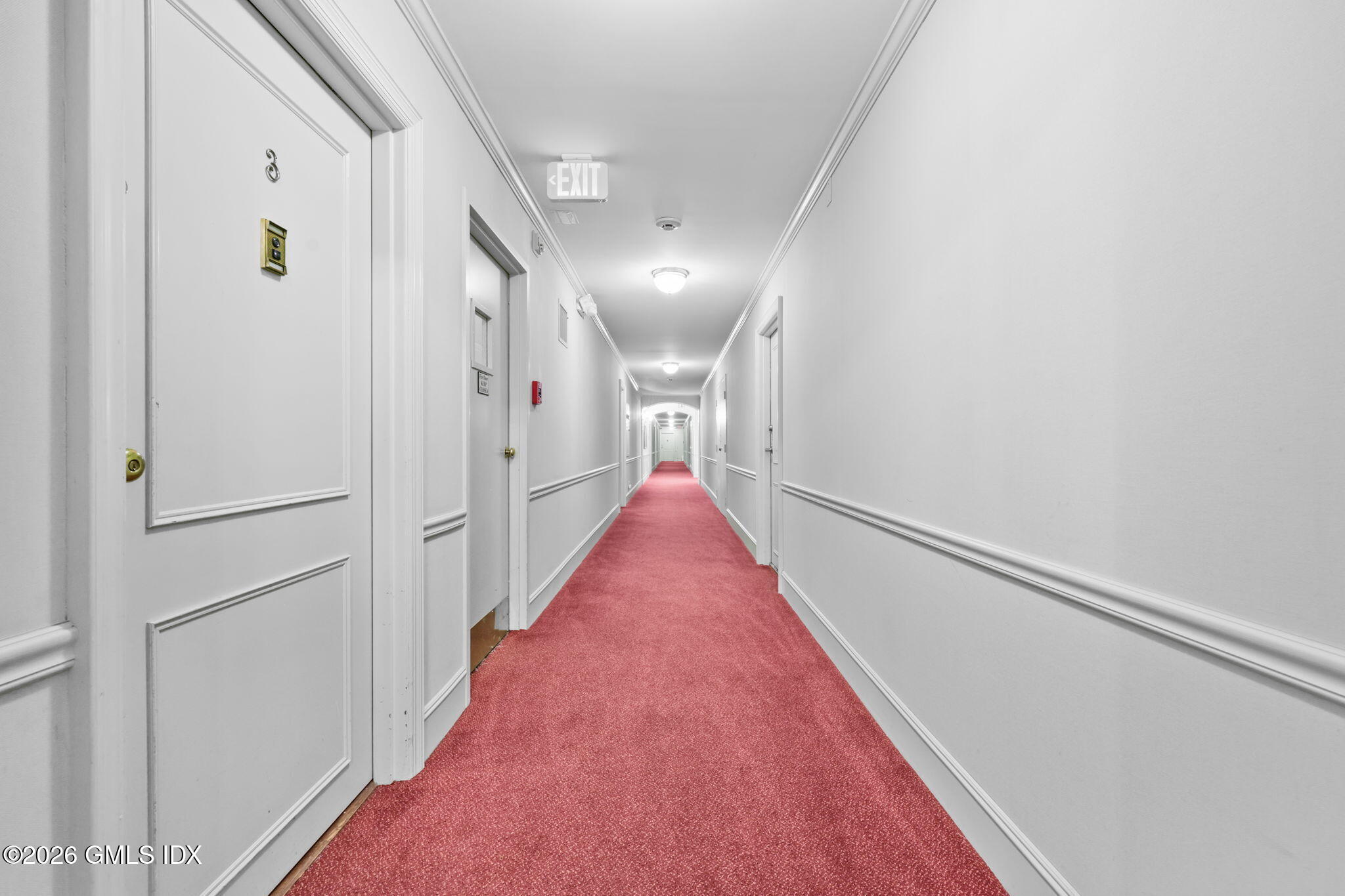 140 Field Point Road, Unit 2 Greenwich, CT 06830 - Photo 7 of 36 a view of a hallway with wooden floor