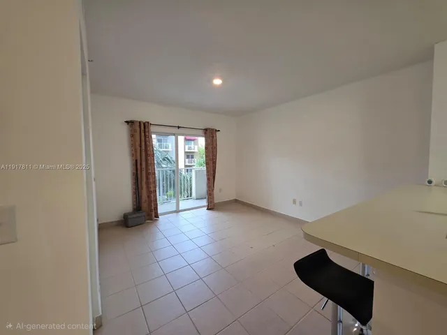 a view of an empty room with glass door