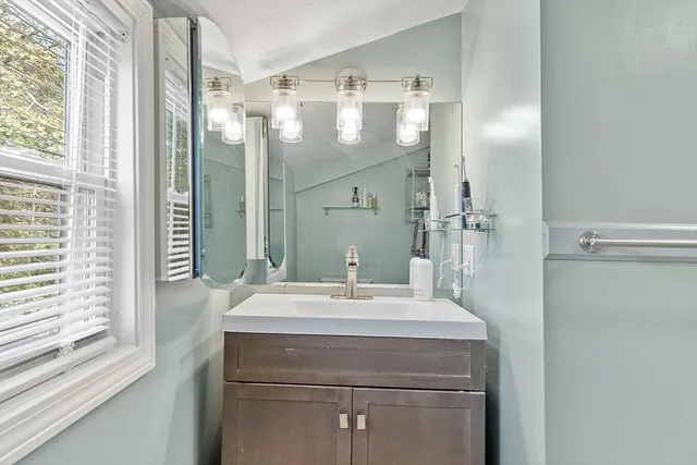 a bathroom with a sink and a mirror