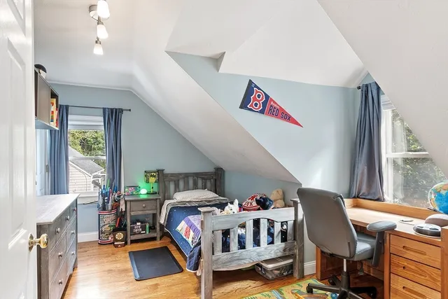 a bedroom with furniture and a window
