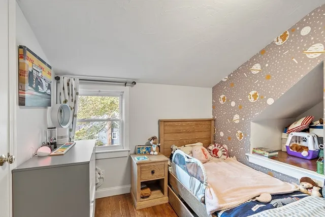 a bedroom with a bed and a desk